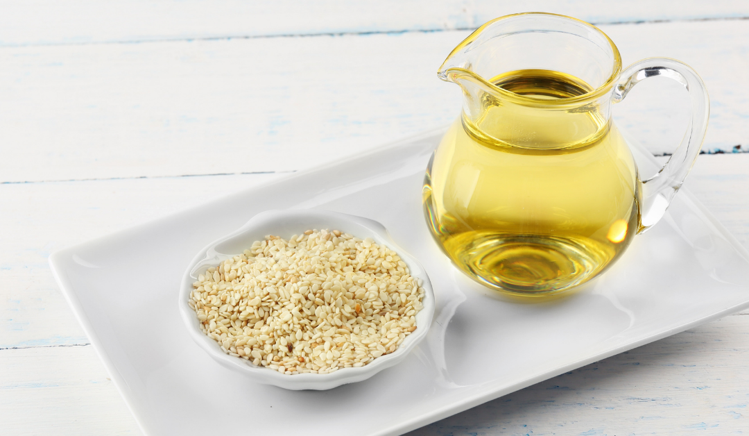 Sesame seed Oil Holpura sesame seed oil in pitcher and sesame seeds in bowl
